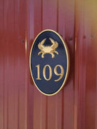Carved Road Address plaque - House number with crab or other stock image (HN1) - The Carving Company