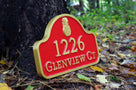Address sign with arched top and pineapple painted maroon and gold
