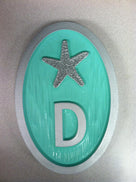 oval house number with starfish front view