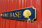 side view of navy blue and gold quarterboard with realistic shells added on ends
