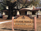 Plank road forestry logo carved on cedar sign