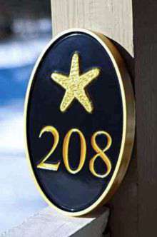 Oval house number sign with starfish as seen in HDTV magazine