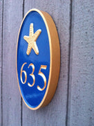 Any color Carved House number with blue and gold starfish iso view