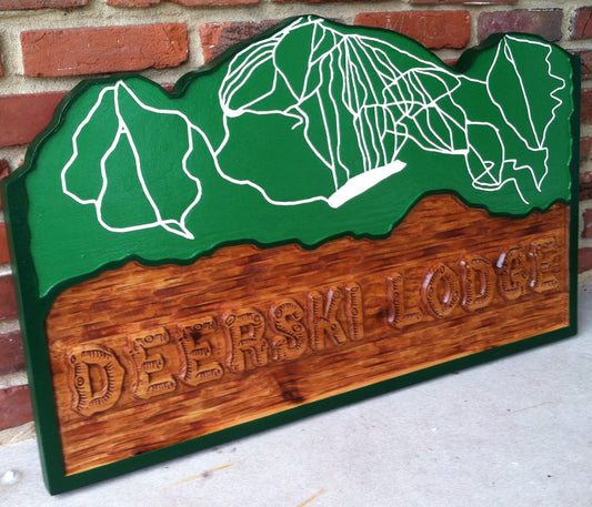 Lodge sign with ski resort map carved in