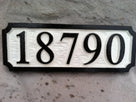 High contrast black and white 5 digit house number sign easy to read