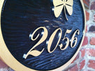 custom carved house number sign with shamrock painted black and gold