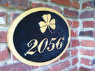 custom carved house number sign with 2056 shamrock painted black and gold