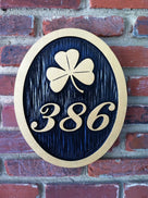 3 digit house number plaque with shamrock and high contrast paint scheme