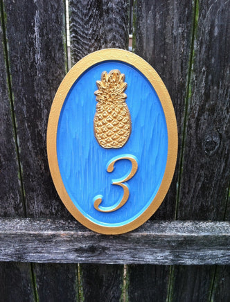 House number sign with bright paint scheme