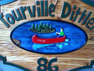 Camp name and number sign made from cedar with hand painted canoe on water image