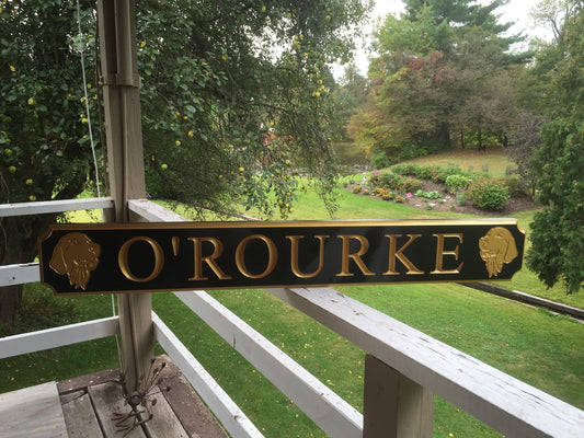 Custom quarterboard with dog breed carved on it painted black and gold