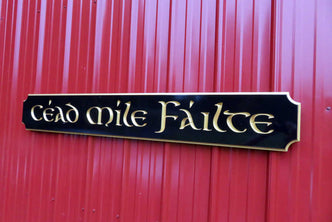 Cead Mile Failte quarterboard sign with gaelic theme