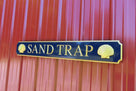 Navy blue and gold custom carved quarterboard with house name carved on it