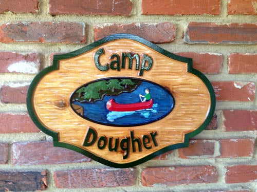 Camp Dougher rustic cedar sign with canoe image - front view