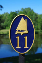 Any color Carved House number with gold catboat on navy background front