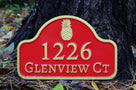Address sign with arched top and pineapple