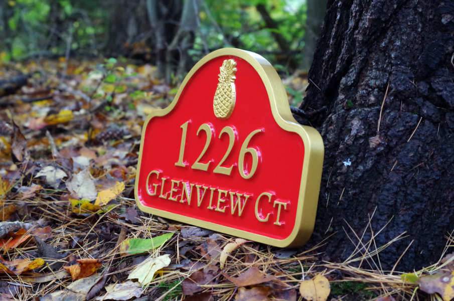 arched top house address sign with pineapple
