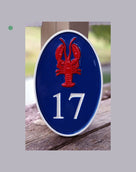 House number sign with number 17 and lobster