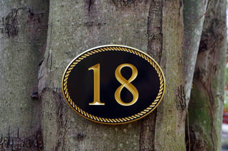 House number with rope border