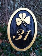 oval house number sign with texture with shamrock image