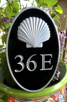 Oval house number sign with 3d shell silver
