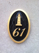 oval house number sign with lighthouse front view