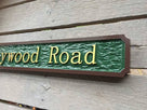 62 heywood road street name sign custom made angle view painted green brown and gold