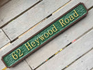 62 heywood road street name sign painted green and brown