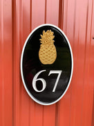 67 pineapple oval house number sign painted black, white and gold