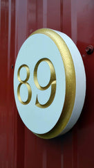 Custom Round Street Number plaque  - Circular House Marker signs (A180) - The Carving Company side view on barn