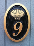 oval house number plaque with shell image nautical theme