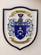 Baczewski Family crest carved and painted in white and blues