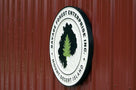 Side view of Tree service business sign round shape