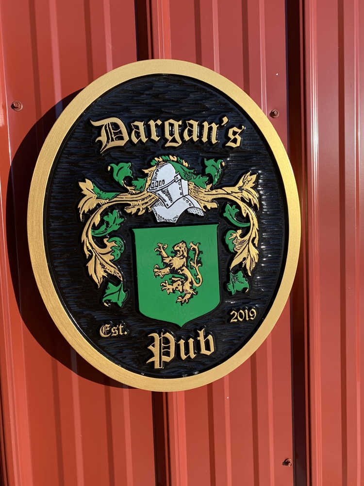 Family Crest for Dargan painted green gold and black