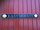 Quarterboard saying Easy Does It with scallop shells on ends custom made