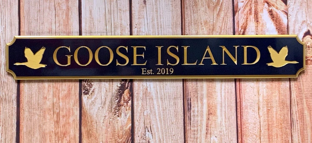 Quarterboard with Goose Island carved on it