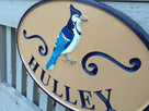 Personalized Last Name Entrance Sign With Blue Jay or other bird- iso right view - Custom Carved Signs (LN23) - The Carving Company