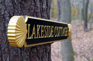 Side view of Lakeside Cottage quarterboard with decorative scallop ends painted black and gold