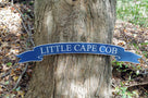 Banner style quarterboard painted blue and silver saying Little Cape Cob