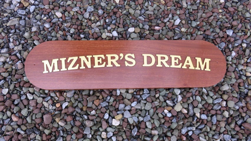 Mahogany quarterboard with Mizner's Dream carved on it