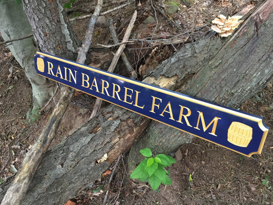 custom quarterboard with rain barrels painted navy blue and gold