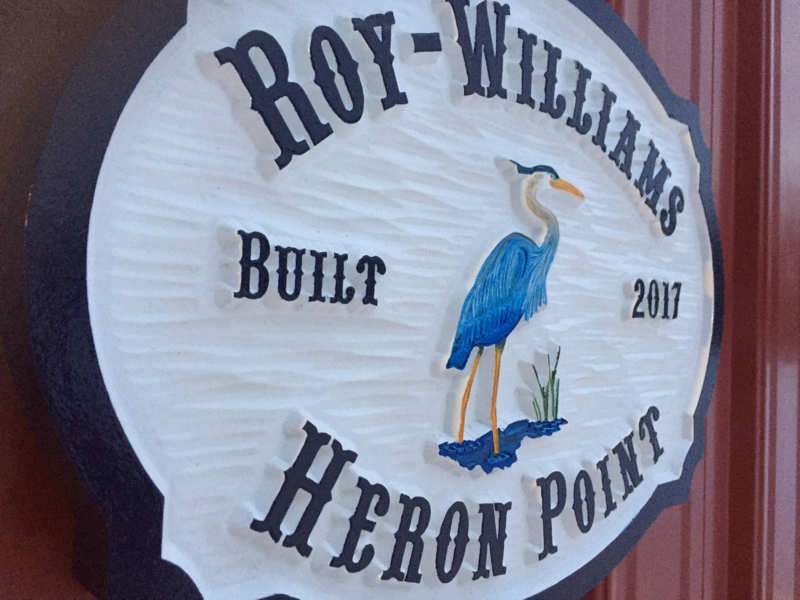 Carved Address plaque with Last Name and blue heron - left iso view (A111) - The Carving Company