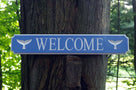 Welcome sign with whale tail images