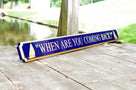 Side view of Navy blue and gold quarterboard with sailboats