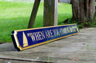 Navy blue and gold quarterboard with sailboats