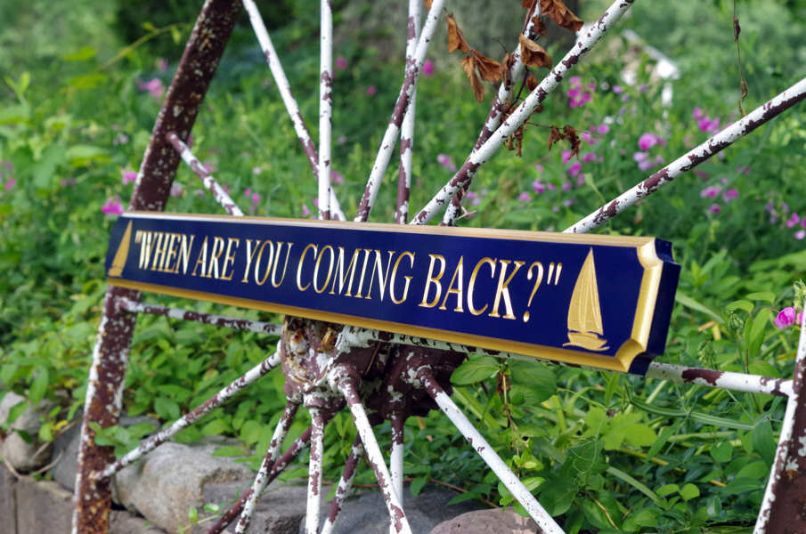 Quarterboard with When are you coming back carved on it