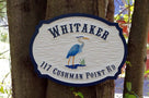 Carved Address plaque with Last Name and blue heron - front view in nature (A111) - The Carving Company