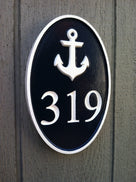 Any color Carved House number with white anchor hung on shed