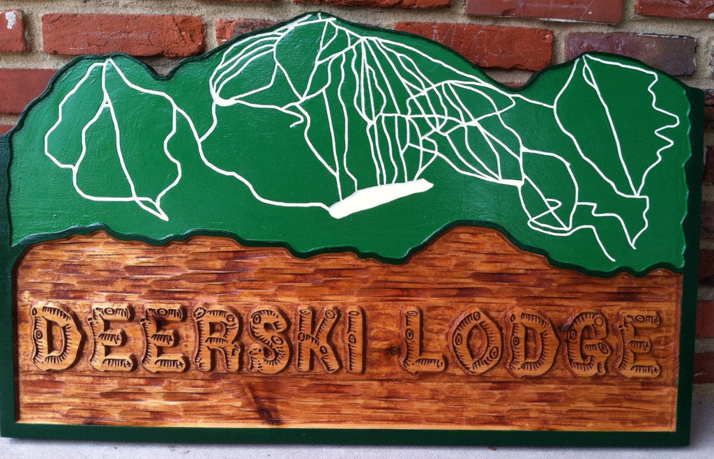 Cedar lodge sign with mountain ski map