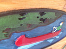 Close up of canoe on camp sign